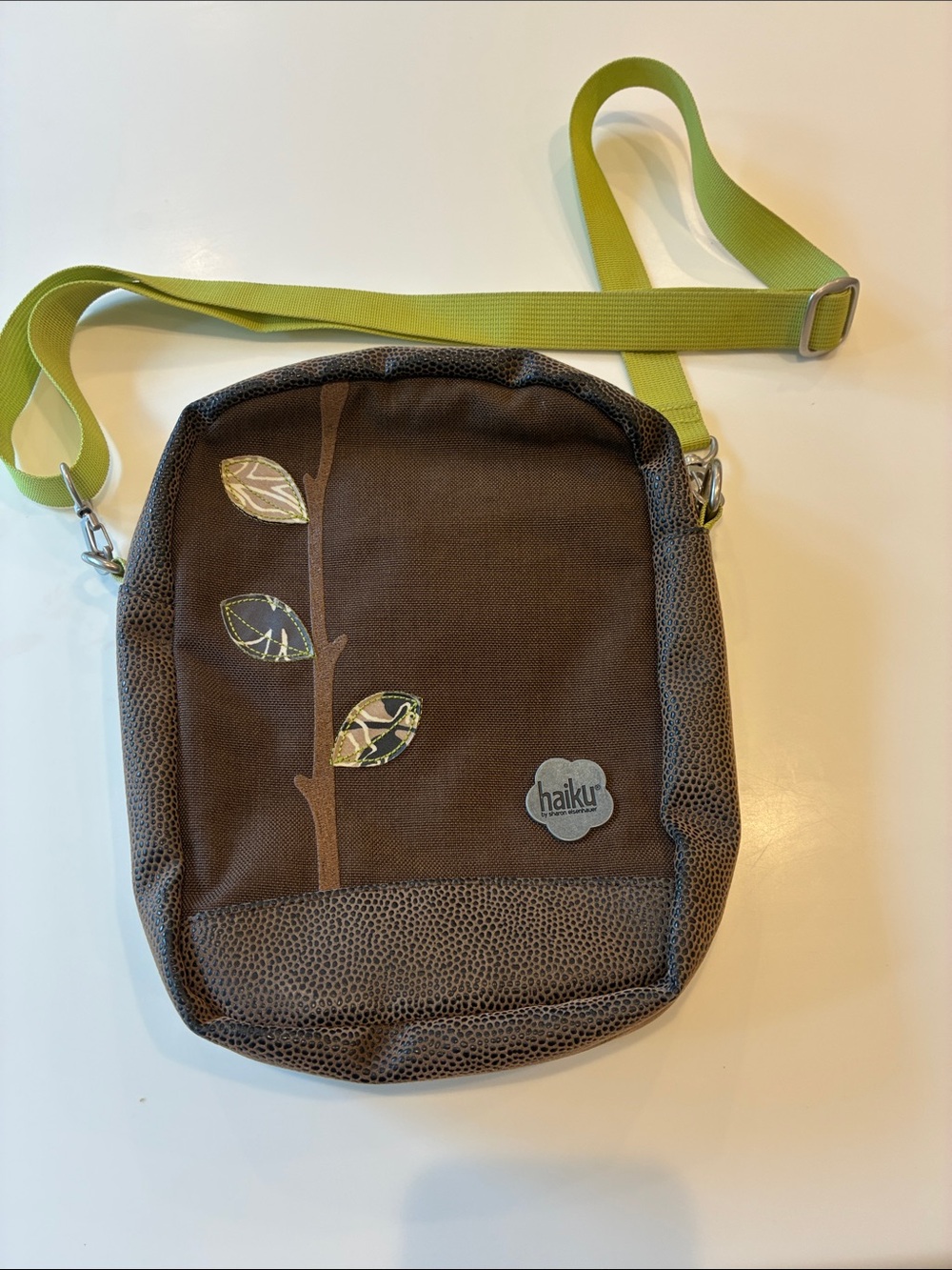 Haiku Brown Crossbody with Lime Green Strap and Leaf Accent
